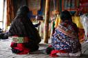 China - Tibet - Maduo - Tibetan Womens backs.JPG