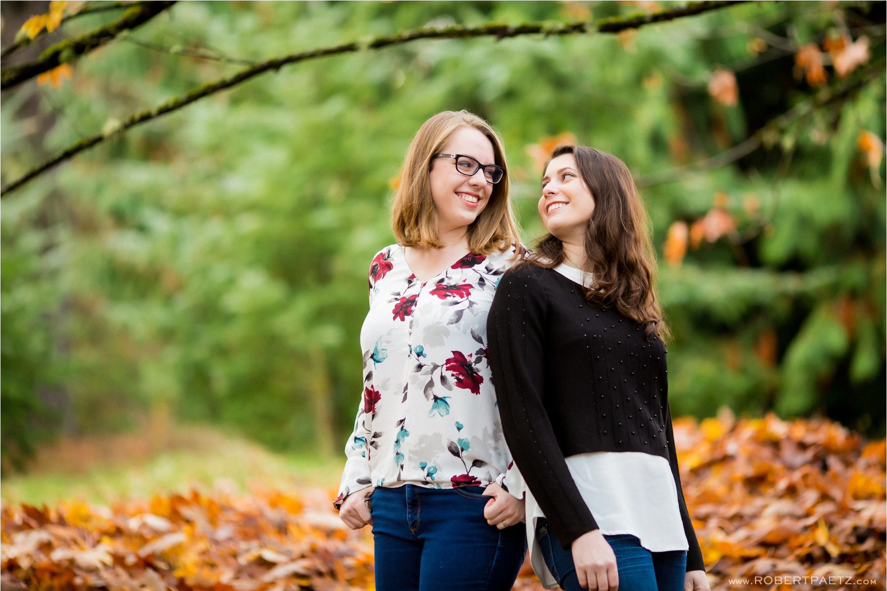 A fall engagement photography session amongst the orange and yellow leaves of Discovery Park in Seattle, photographed by the destination wedding photographer, Robert Paetz. 